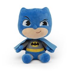 a blue stuffed toy with a batman costume on it's chest and eyes open