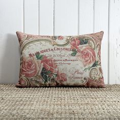 a decorative pillow with roses on it