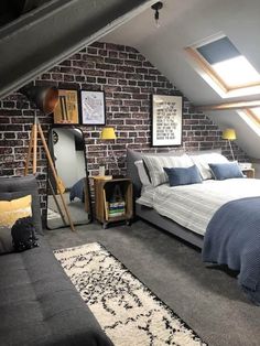 an attic bedroom with exposed brick walls and gray carpeted flooring, along with a large bed in the corner