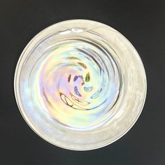 a glass bowl filled with water on top of a table