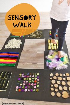 a child standing on top of a wooden floor next to some sort of crafting materials