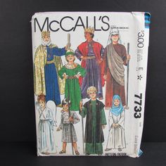 an image of children's medieval costumes on the cover of a sewing pattern book