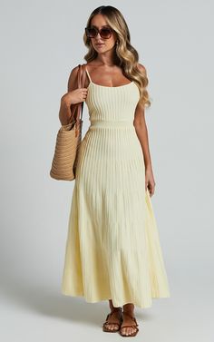 Catch everyone's attention with the Donissa Midi Dress in butter yellow. This fit and flare dress is perfect for any party or special occasion, featuring a square neckline and sleeveless design that flatters all body types. The panelled knit dress hugs your curves in all the right places, while the acrylic material keeps you comfortable and stylish throughout the day or night. Stand out from the crowd with this vibrant yellow midi dress that exudes confidence and empowerment.Product Details:Fit Midi Day Dress, Summer Day Dresses Casual, Garden Party Guest Attire, Winery Dresses Outfit, Butter Yellow Dress, Yellow Dress Wedding Guest, The Hamptons Fashion, Fit And Flare Dress Casual, Butter Yellow Outfit