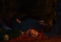 a woman laying on the ground next to a giant monster in a forest at night