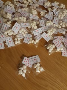 several bags filled with white chocolate chips on top of a wooden table