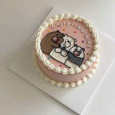 a birthday cake with two bears on it