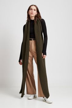 Make your style A LOT cozier with our extra-long Bronx Scarf. Bronx is both knit from ultra-soft French Merino Wool mix to warm your soul and fashioned extra long to make a statement. Wrap this Merino wool scarf around and around for volume, or wear her draped over your shoulders to lend your look texture and drama. This soft wool scarf also doubles perfectly as an airplane blanket.[SPLIT] Steph, in olive, is 5'11" (180 cm) tall. Maritza, in black, is 5'9.5" (177 cm) tall. Julia, in light beige, Burnt Yellow, Merino Wool Scarf, Cozy Accessories, Crochet Clothing, Oversized Scarf, Long Scarf, Grey Women, Soft Wool, Wool Scarf