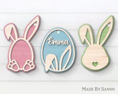 three wooden cutouts of easter bunnies and rabbits