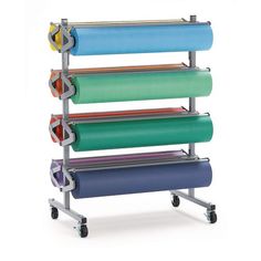 a multicolored rolling rack holds several rolls of paper