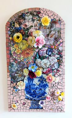 an art work with flowers and mosaic tiles