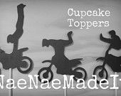 three cupcake toppers with the words nadnemadeit in white and black