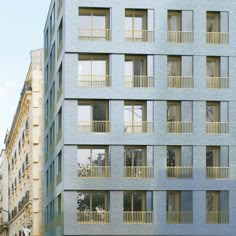 an apartment building with balconies and windows