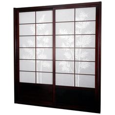 an image of a window with frosted glass on the outside and bamboo leaves on the inside