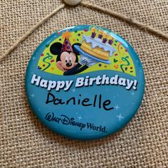 a button that says happy birthday danielle with a mickey mouse on it's face