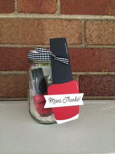 a mason jar with a note attached to it