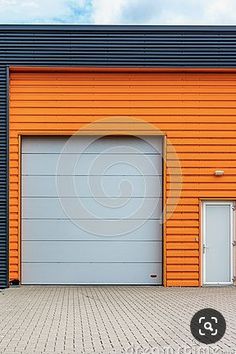 an orange garage with two doors