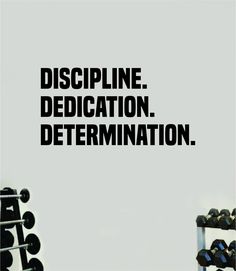 a black and white photo with the words discipline dedication determination above dumbbells in front of a gray background