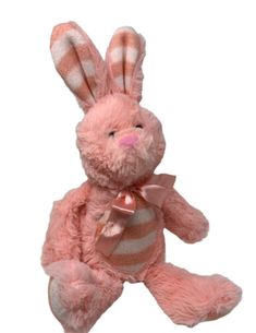 a pink stuffed rabbit with stripes on it's chest and ears, sitting in front of a white background