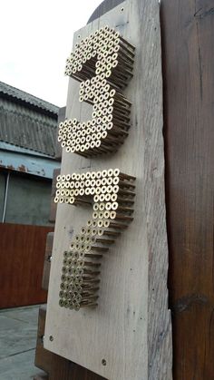 a piece of wood that has some type of object made out of metal rivets