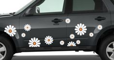 a car with flowers painted on it's side