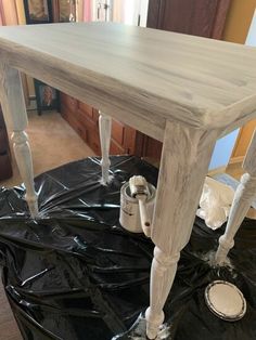 the table is being painted with white paint