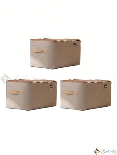 two beige storage boxes sitting next to each other