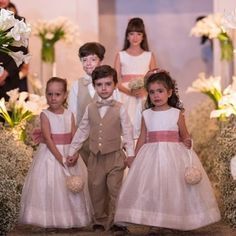 the children are walking down the aisle together