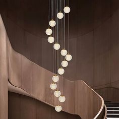 a staircase with many lights hanging from it