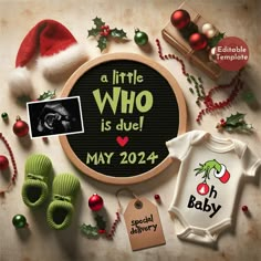 the birth announcement for a baby is displayed in front of christmas decorations and other items