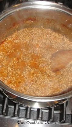 a pot filled with food sitting on top of a stove