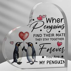 a glass heart shaped with two penguins holding a red balloon and the words when penguins find their mate they stay together forever you are my penguin