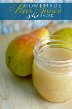 homemade pear sauce in a glass jar next to two pears