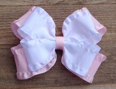 "~Double Ruffle Hair Bow for Girls~ COLOR: Light Pink This listing is for a Double Ruffle Bow made from 1.5\" satin double ruffle ribbon. These bows add a nice touch to a dressy outfit, PERFECT for any dressy occasion. All my items are hand sewn through the center of each bow so the loops will remain the same size through years of enjoyment. All the ends have been heat sealed to prevent fraying, and they are attached to a partially lined alligator clip or baby headband. Please leave baby headban Pink Ribbon Bow For Spring, Pink Hair Bow Accessories For Spring, Pink Satin Bow Hair Accessories For Spring, Pink Bow Gift For Spring, Spring Pink Hair Accessories With Satin Bow, Spring Pink Satin Bow Hair Accessories, Spring Pink Hair Accessories With Bow, Cute White Bow With Matching Headband, Pink Bow Tie Hair Accessories For Party