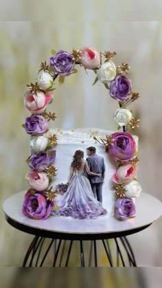 a wedding cake decorated with purple and white flowers