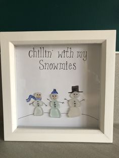 three snowmen in a white frame with words written on the wall behind them that says chillin'with my snowmies