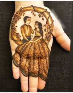 a hand painted with an image of a man and woman holding each other's hands