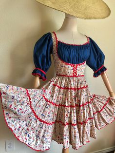 "Vintage 70s beige & navy prairie swing dress. Featuring the cutest novelty folk print with cats, bunnies, birds, foxes, owls and more. Four tier full circle skirt, red ric-rac trim, large puff sleeves and zip up back.  Tag: none / handmade  Era: 1970s  Fits a small-medium, see measurements below for accurate fit.  Material: cotton  -M E A S U R E M E N T S- Taken when laid flat / double where needed  Pit to pit: 19\" Waist: 13.5\" Hips: free Length: 36\" 💌 This item has free US shipping *Please note that all items are previously loved and may show signs of wear. Any major wear to the pieces will be noted. *due to the nature of our business we do not offer exchanges or returns. Please be sure to check description and photos and ask any questions you may have before purchasing. Follow us o 70s Texas Fashion, Square Dancing Outfit, Square Dance Dress, Square Dance Dresses, Folk Print, Texas Fashion, 2024 Aesthetic, Quilt Dress, Dance Ideas