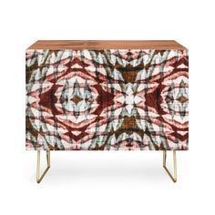 the sideboard with an abstract design in red, white and brown colors on it