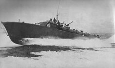 an old photo of a boat in the water with people riding on top of it