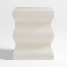 an abstract white sculpture is shown against a white background