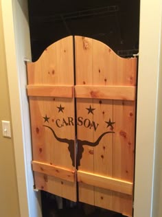 two wooden doors with the word carbon written on them and stars painted on each door