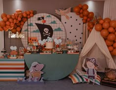 there is a pirate themed party with balloons and decorations on the table, along with other items