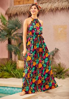 Journey into paradise with our navy tropical print maxi dress. Its flowy silhouette, complemented by a drawstring neckline and tie waist, ensures a flattering fit for all your island escapades or park lounging sessions. With pockets for treasures found along the way, this garment is not only a style statement but a voyage to comfort and splendor. 100% Viscose Machine wash cold, line dry Imported Woven Model Sizing HEIGHT: 5' 7" BUST: 33 IN WAIST: 24 IN HIPS: 35 IN | ModCloth Illuminated Elegance Tropical Print Maxi Dress, Island Wear, Drawstring Neckline, Printed Maxi, Tropical Print, Printed Maxi Dress, S Models, Pretty Outfits, Nice Dresses