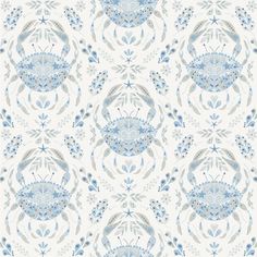 a blue and white wallpaper with an ornate design