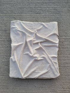 a white piece of cloth on the ground