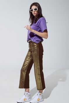 Elevate your denim collection with our Brown Straight Leg Jeans, featuring a subtle gold metallic glow for a touch of sophistication. Made from 100% cotton, these jeans offer both comfort and style. The high waist and ankle length provide a flattering silhouette, while the wide leg design ensures a trendy and relaxed look. Perfect for both casual and dressed-up occasions, these jeans are versatile enough to pair with a t-shirt for a laid-back vibe or with a shirt and blazer for a more polished e