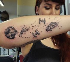 a woman with a star wars tattoo on her arm