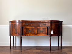 an old wooden sideboard with two drawers on one end and a drawer on the other