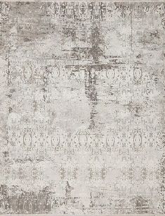 an old rug with faded paint on the top and bottom, in grey tones is shown