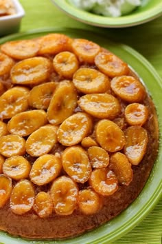 a pineapple upside down cake on a green plate